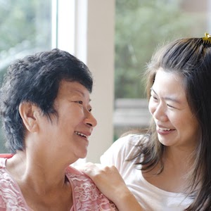 A nurse caring for a patient in house