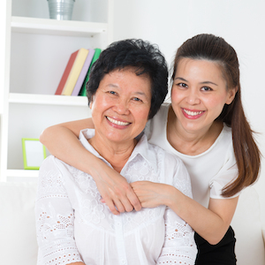 Senior woman and daughter. Happy Asian family senior mother and adult offspring having fun time at home.