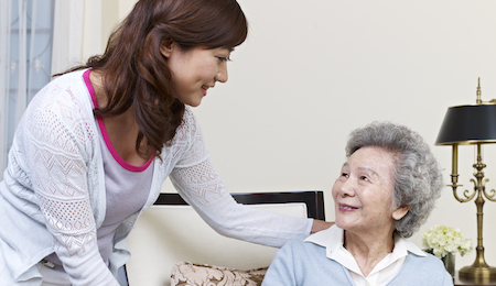 senior asian woman and her adult daughter.