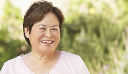 Smiling Senior Woman In Garden