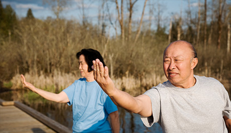 elderly couple doing tai chi and other senior activities