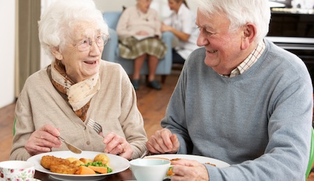 Old couple sharing a meal together